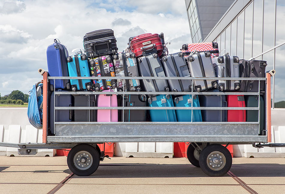 Trailer transporting baggage between aircraft terminal and aircraft